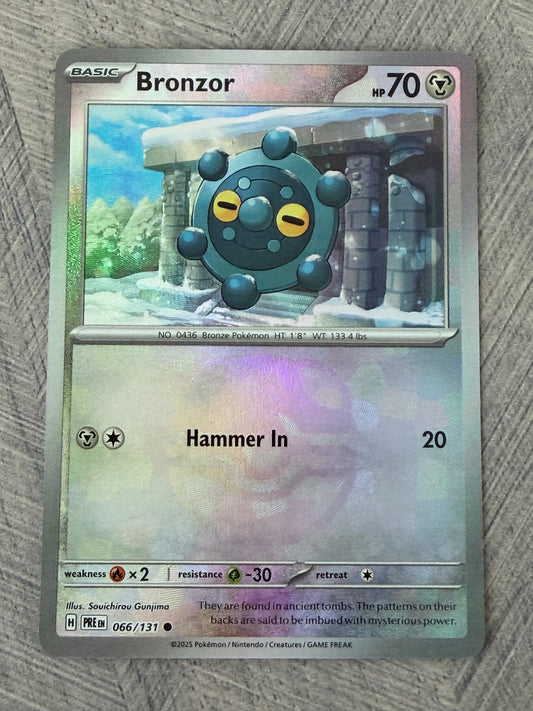 Bronzor 066/131 Masterball Prismatic Evolutions Pokémon Card - English